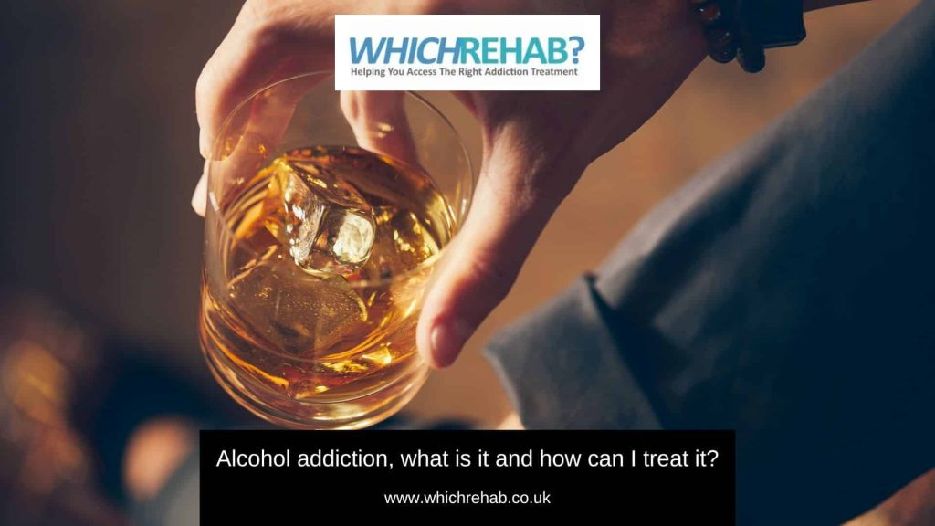 A man holding a glass of whisky