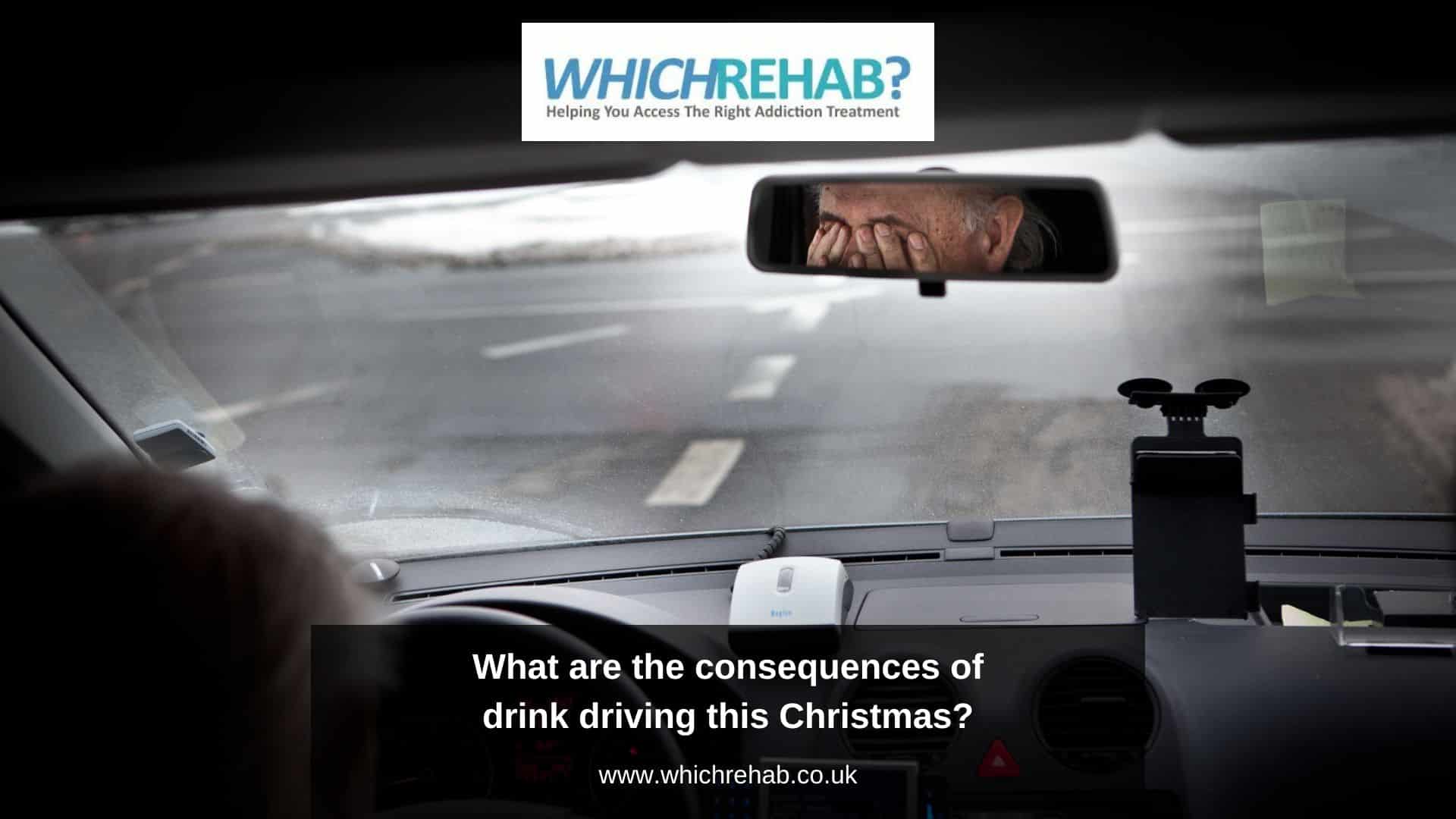 A rear view mirror view of a sad man sitting in a car rubbing his eyes - Which Rehab