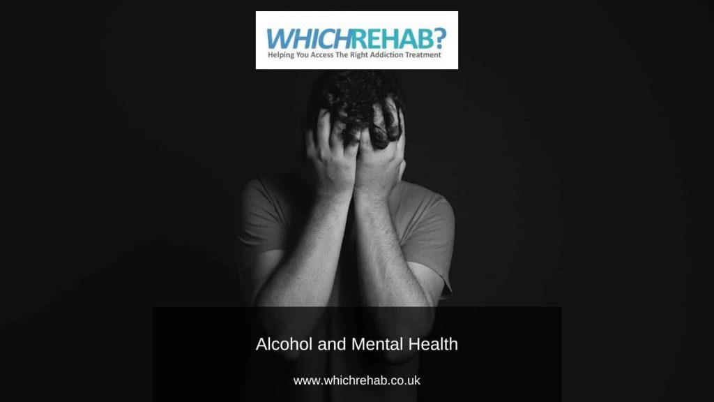 A greyscale shot of a man standing with his head in his hands - Which Rehab